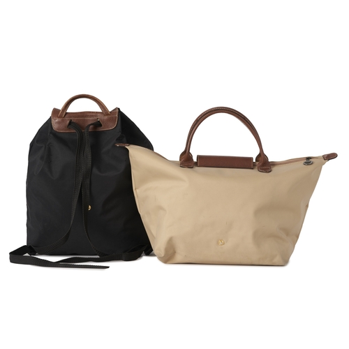 417 - Longchamp, two Le Pliage bags, to include a medium beige nylon tote with tan leather handles and tri... 