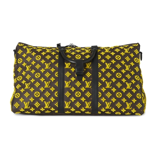 422 - Louis Vuitton, a monogram Tuffetage Triangle Keepall Bandouliere 50 luggage bag, designed with a bro... 