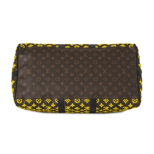 422 - Louis Vuitton, a monogram Tuffetage Triangle Keepall Bandouliere 50 luggage bag, designed with a bro... 