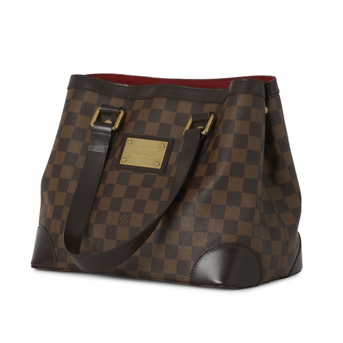 431 - Louis Vuitton, a damier Hampstead PM handbag, with gold-tone hardware, brown leather trim, an engrav... 