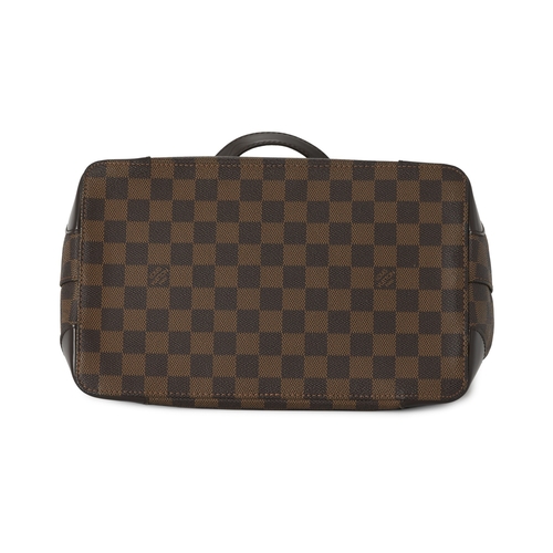 431 - Louis Vuitton, a damier Hampstead PM handbag, with gold-tone hardware, brown leather trim, an engrav... 