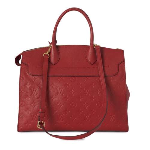 442 - Louis Vuitton, a monogram empreinte Pont Neuf MM handbag, crafted from monogram embossed red leather... 