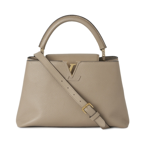443 - Louis Vuitton, a Capucines PM handbag, crafted from grey Taurillion leather with gold-tone hardware,... 