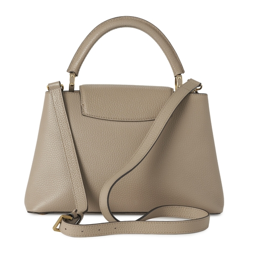 443 - Louis Vuitton, a Capucines PM handbag, crafted from grey Taurillion leather with gold-tone hardware,... 
