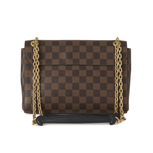 447 - Louis Vuitton, a damier ebene Vavin PM handbag, featuring a cream leather front pocket, gold-tone ha... 