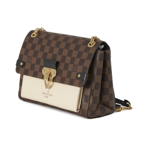 447 - Louis Vuitton, a damier ebene Vavin PM handbag, featuring a cream leather front pocket, gold-tone ha... 