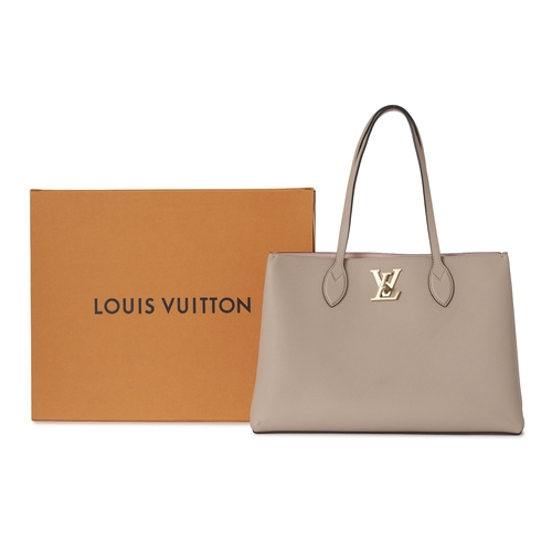 450 - Louis Vuitton, a Lockme shopper tote, featuring a grey grained calfskin leather exterior with gold-t... 
