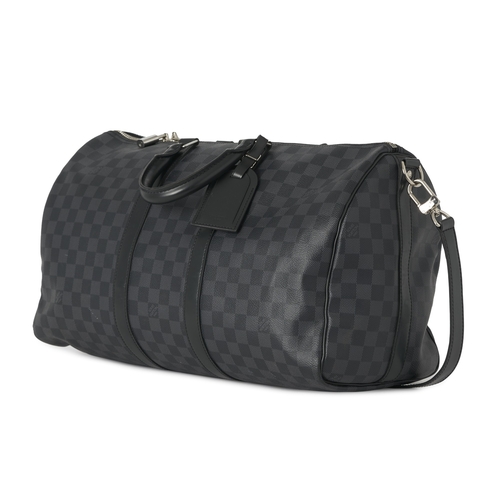 453 - Louis Vuitton, a damier graphite Keepall 45 luggage bag, featuring black leather trim, rolled leathe... 
