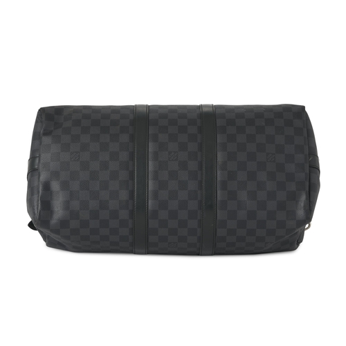 453 - Louis Vuitton, a damier graphite Keepall 45 luggage bag, featuring black leather trim, rolled leathe... 