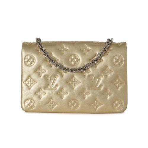 455 - Louis Vuitton, a gold Pochette Coussins pouch, featuring a monogram embossed puffy lambskin leather ... 