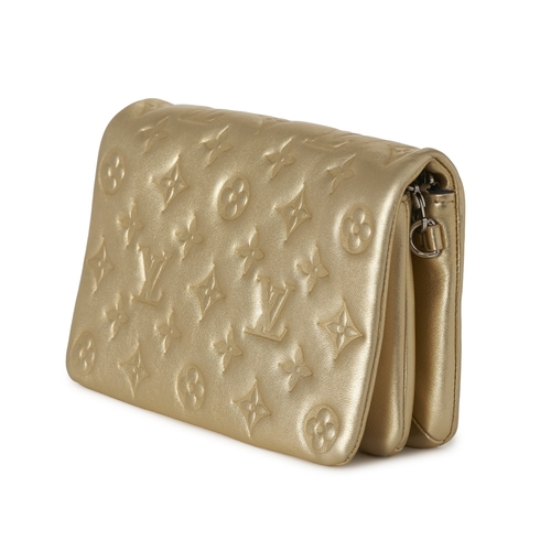 455 - Louis Vuitton, a gold Pochette Coussins pouch, featuring a monogram embossed puffy lambskin leather ... 