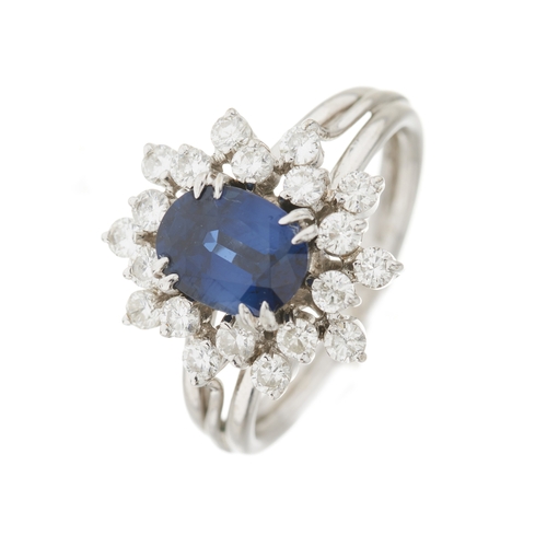 46 - A sapphire and brilliant-cut diamond cluster dress ring, with grooved band, sapphire estimated weigh... 