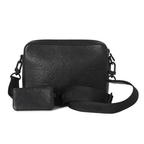461 - Louis Vuitton, a monogram shadow Duo messenger bag, crafted from black monogram embossed calf leathe... 