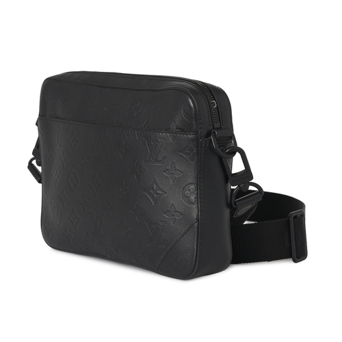 461 - Louis Vuitton, a monogram shadow Duo messenger bag, crafted from black monogram embossed calf leathe... 
