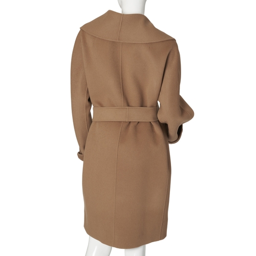 471 - Max Mara, a pure wool camel coat, featuring a lapel collar, waist belt fastening and two outer pocke... 