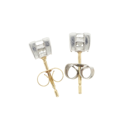 49 - A pair of 18ct gold square-shape diamond single-stone stud earrings, estimated total diamond weight ... 