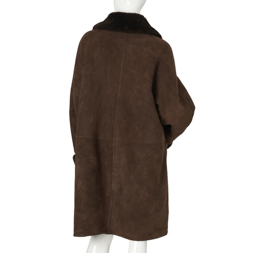 510 - Maska, a ladies brown shearling coat, short lapel collar, button fastenings and two outer pockets, l... 