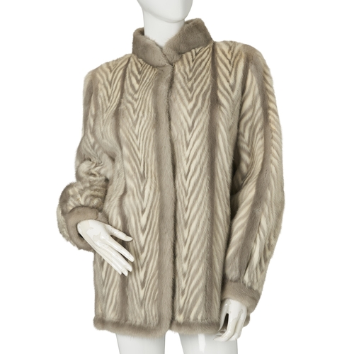 515 - A two-tone chevron mink jacket, featuring a sapphire and white mink chevron pattern, with a short Ma... 