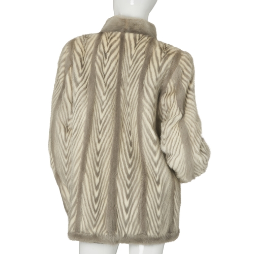 515 - A two-tone chevron mink jacket, featuring a sapphire and white mink chevron pattern, with a short Ma... 