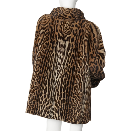 520 - Jenners, a 1950s ocelot fur coat, featuring a lapel collar, hook and eye fastenings, rolled cuffs, t... 