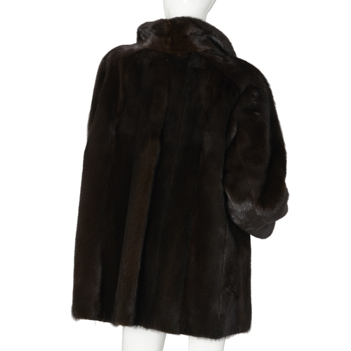 522 - Blackglama, a dark ranch mink jacket, featuring a lapel collar, hook and eye clip fastenings, fitted... 