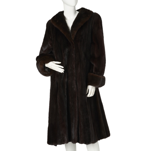 537 - A ranch mink coat, with a lapel collar, hook and eye clip fastenings, cocktail cuffs, two exterior p... 