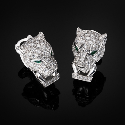 62 - Cartier, a pair of 18ct white gold pave-set diamond, Panthere de Cartier earrings, with emerald eyes... 
