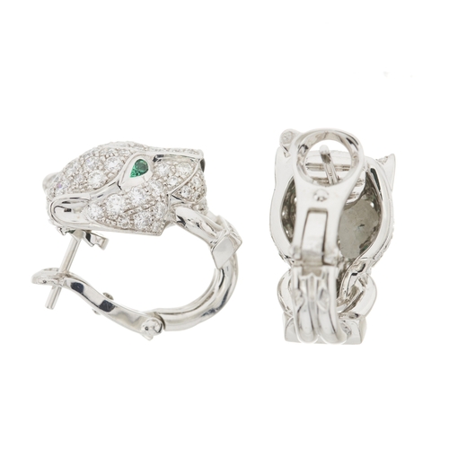 62 - Cartier, a pair of 18ct white gold pave-set diamond, Panthere de Cartier earrings, with emerald eyes... 