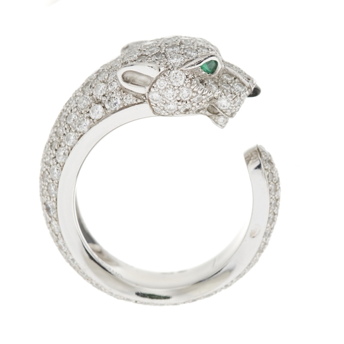 63 - Cartier, an 18ct white gold pave-set diamond Panthere de Cartier ring, medium model, with emerald ey... 