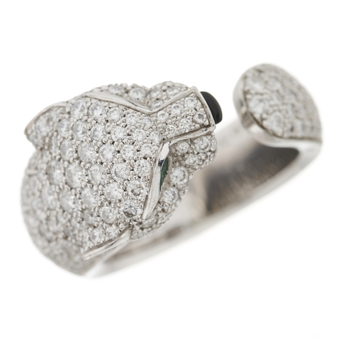63 - Cartier, an 18ct white gold pave-set diamond Panthere de Cartier ring, medium model, with emerald ey... 