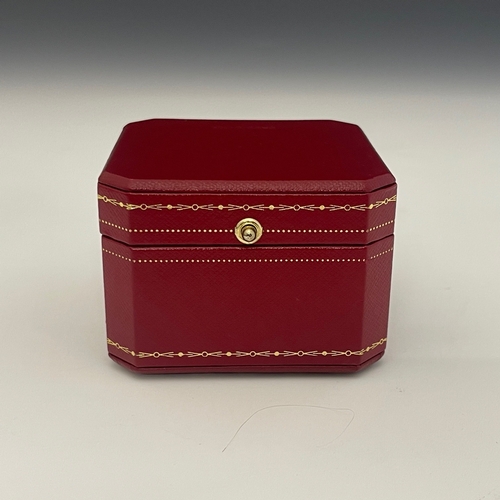 63 - Cartier, an 18ct white gold pave-set diamond Panthere de Cartier ring, medium model, with emerald ey... 