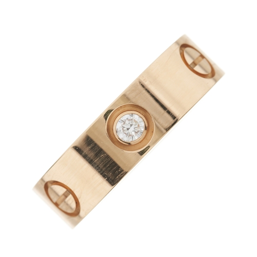 66 - Cartier, an 18ct rose gold Love ring, with brilliant-cut diamond trio highlights and screw head moti... 