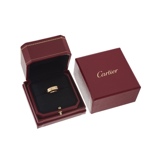 66 - Cartier, an 18ct rose gold Love ring, with brilliant-cut diamond trio highlights and screw head moti... 