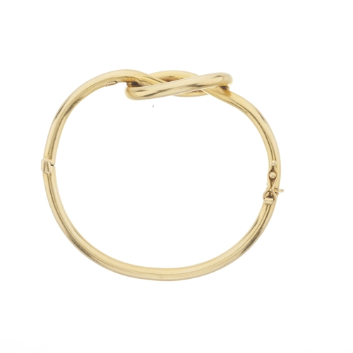 67 - Ilias Lalaounis (attributed), an 18ct gold love knot hinged bangle bracelet, stamped 750, Greece, in... 