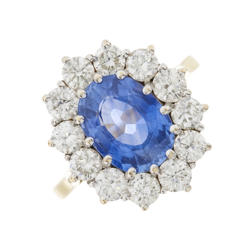 74 - An 18ct gold sapphire and brilliant-cut diamond cluster ring, sapphire estimated weight 2.50ct, esti... 