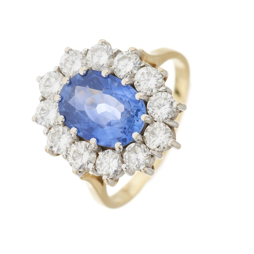 74 - An 18ct gold sapphire and brilliant-cut diamond cluster ring, sapphire estimated weight 2.50ct, esti... 