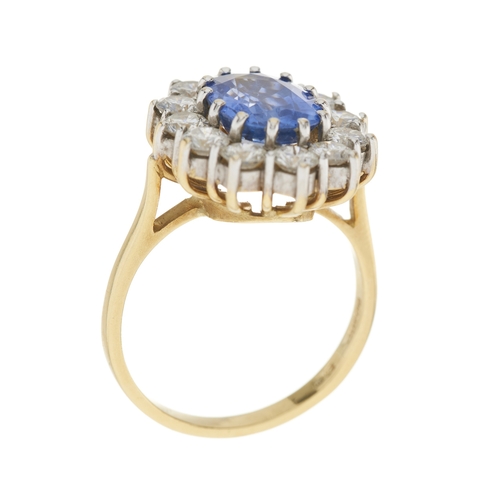 74 - An 18ct gold sapphire and brilliant-cut diamond cluster ring, sapphire estimated weight 2.50ct, esti... 