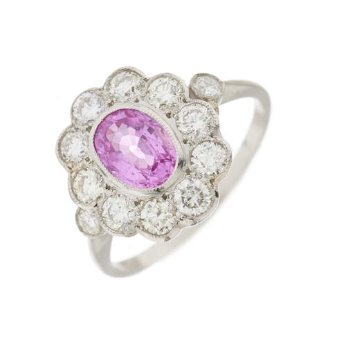 76 - A platinum pink sapphire and brilliant-cut diamond cluster ring, sapphire estimated weight 0.90ct, e... 