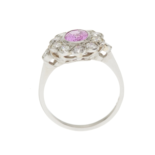76 - A platinum pink sapphire and brilliant-cut diamond cluster ring, sapphire estimated weight 0.90ct, e... 