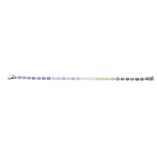 77 - A 14ct gold vari-hue harlequin sapphire and brilliant-cut diamond line bracelet, estimated total sap... 
