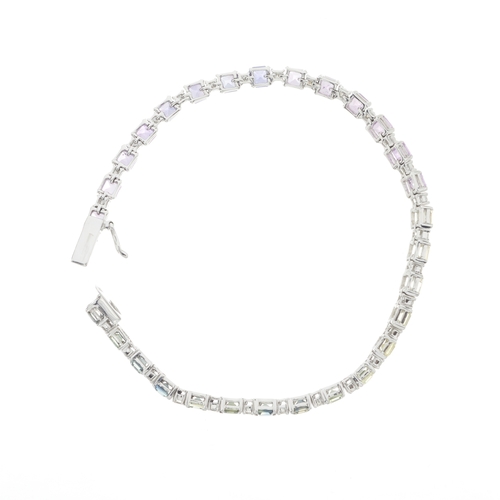 77 - A 14ct gold vari-hue harlequin sapphire and brilliant-cut diamond line bracelet, estimated total sap... 