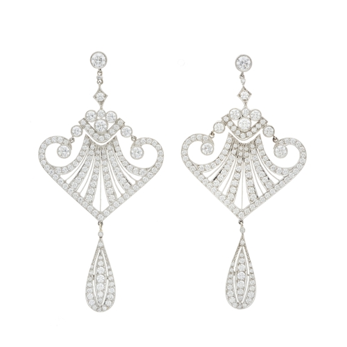 79 - A pair of platinum brilliant-cut diamond drop earrings, estimated total diamond weight 4 to 4.50ct, ... 