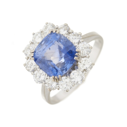 80 - An 18ct gold Sri Lankan sapphire and brilliant-cut diamond cluster ring, with report from WGI statin... 