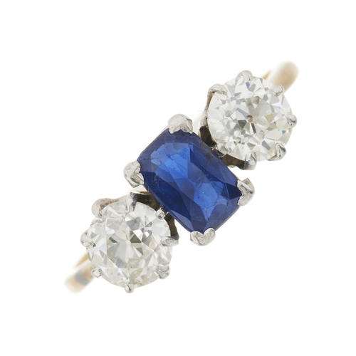 87 - A mid 20th century 18ct gold cushion-shape sapphire and old-cut diamond three-stone ring, estimated ... 