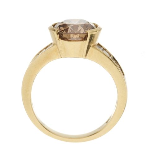 95 - An 18ct gold brilliant-cut coloured diamond single-stone dress ring, with calibre-cut colourless dia... 