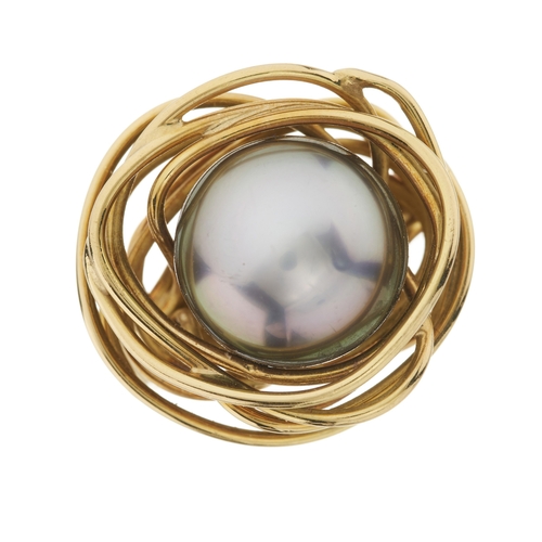 97 - An 18ct gold grey cultured pearl dress ring, with stylised bird's nest wire surround and textured ba... 