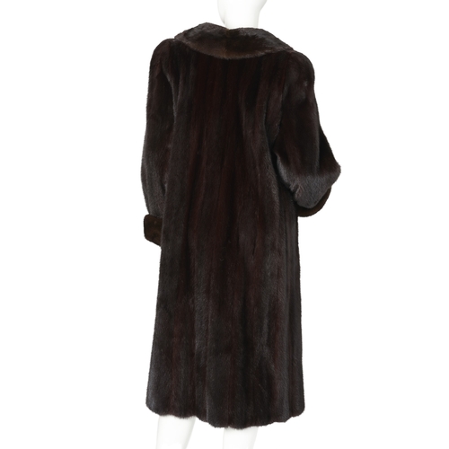 537 - A ranch mink coat, with a lapel collar, hook and eye clip fastenings, cocktail cuffs, two exterior p... 