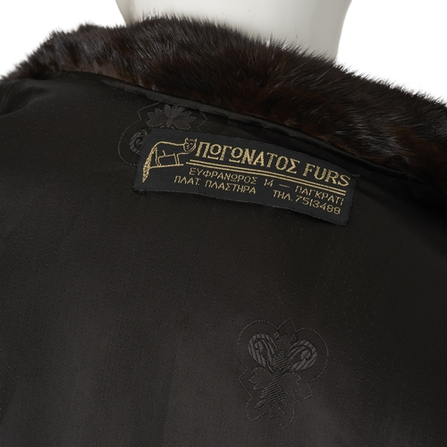 537 - A ranch mink coat, with a lapel collar, hook and eye clip fastenings, cocktail cuffs, two exterior p... 