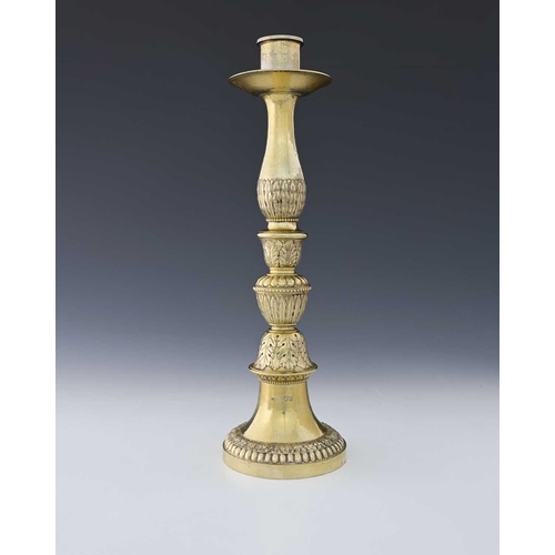 113 - Guild of Handicraft (George Henry Hart), an Edward VII silver-gilt Arts & Crafts style candlestick, ... 