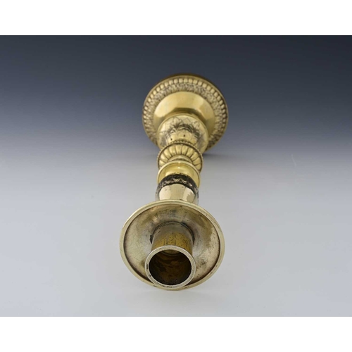 113 - Guild of Handicraft (George Henry Hart), an Edward VII silver-gilt Arts & Crafts style candlestick, ... 